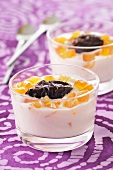 Creamy dessert with preserved prunes and crystallised fruit