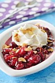 Stewed cranberries topped with creamy coconut and slivered almonds