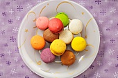 Colourful macaroons on a plate (Christmassy)