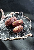 Minced meat sausages with pig's caul