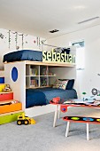 Cozy and colorful drawer stair bunk beds; child's name on the safety rail