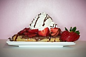 Dessert Waffle Topped with Chocolate Sauce, Strawberries and Whipped Cream
