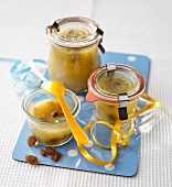 Apple sauce with raisins in preserving jars