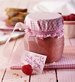 Raspberry spread in a preserving jar as a gift
