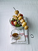 Potato salad with a skewer of potatoes