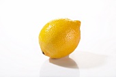 A lemon on a white surface