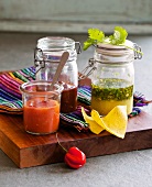 Three Mexican sauces in jars
