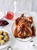 Stuffed turkey wrapped in bacon with cranberry chutney