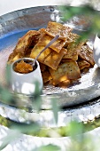 Deep-fried semolina squares with orange marmalade (Tunisia)