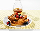 French toast with maple syrup and berries