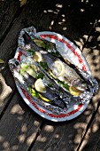 Barbecued trout wrapped in foil