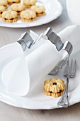 Teapot-shaped pastry cutter used as napkin ring