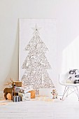 Hand-crafted Christmas tree made from nails & thread on wooden panel