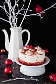 Red Velvet Cake on a Pedestal Dish with Christmas Ornaments