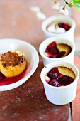 Cherry soufflés in ramekins and in a dessert bowl