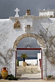 View of courtyard and landscape through arched doorway