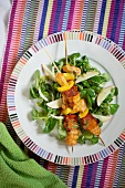 Pork and chorizo kebabs with lamb's lettuce