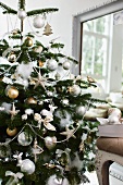 Opulently decorated Christmas tree in living room