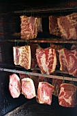 Ham hanging in a smokehouse