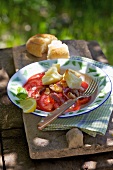 Tomato salad with onions and Scamorza cheese