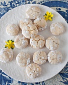 Orange and coconut biscuits made using quark dough, on a white plate