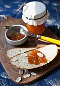 Apple bread with slivered almonds and peach jam