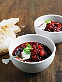 Borscht with sour cream, dill and bread
