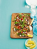 Pizza topped with lamb mince, feta, tomatoes and mint (Greece)