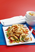 Deep-fried squid on a bed of peppers and sugar snap peas (China)