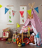 Christmas gifts for a child's bedroom and garden picnics: wigwam, toys, bunting, lamps, picnic case
