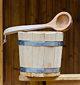 Wooden water bucket and ladle for the sauna