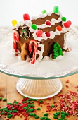 Gingerbread house on cake stand