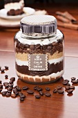 Assorted ingredients for coffee in a screw-top jar as a gift