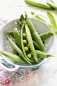 Young peas in a colander