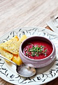 Beetroot cream soup with thyme and baked potatos