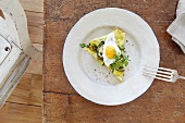 A slice of courgette frittata with a fried egg