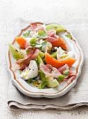 Melon salad with ham and egg