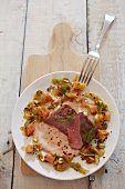 Saddle of lamb with root vegetables