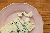 A slice of blue cheese on a plate
