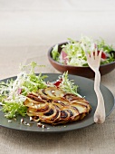 Potato cakes with porcini mushrooms and a side of salad