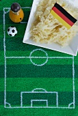 Sauerkraut with a German flag and football-themed decoration