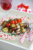 Fried potatoes with sausages and cherry tomatoes