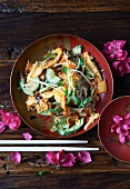 Japanese Squid Salad in a Bowl; Chopsticks and Flowers
