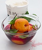 Poached peaches with basil, vanilla ice cream