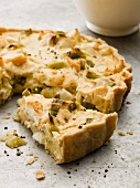 Spicy leek tart with cheese, partly sliced