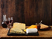 Speciality Christmas cheeseboard selection. Stilton, goats cheese, red leicester and cheddar with red wine and crackers