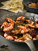 King prawns with black pepper, olives and sliced chillies