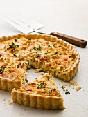Crab tart with thyme, one slice cut