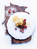 Profiteroles with tonka bean & chocolate cream and raspberries