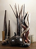 Vases and tea light holders in shades of brown and glass vases with horns